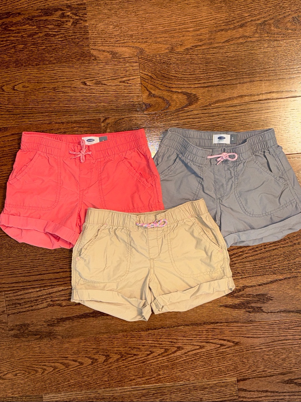 Size 8/M girls bundle of 3pull-on shorts from Old Navy. Pink, gray, khaki.